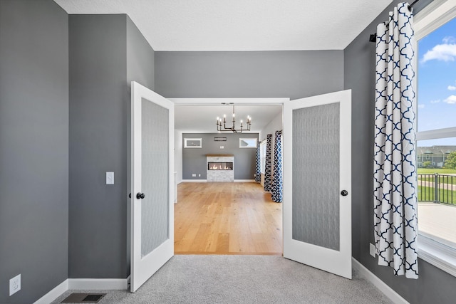 14221 Aspen Ave, Rosemount, MN 55068 - foyer entrance featuring a chandelier and carpet flooring