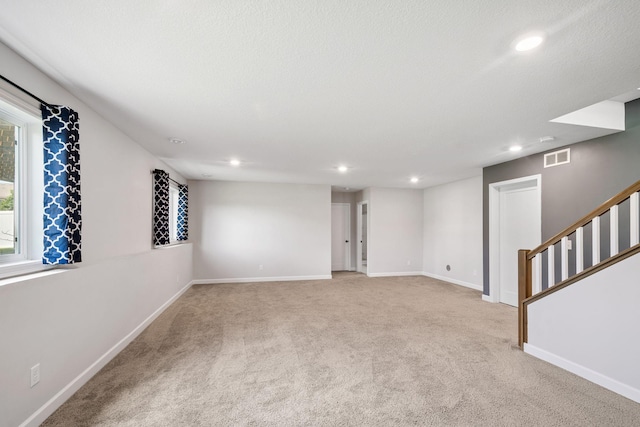 14221 Aspen Ave, Rosemount, MN 55068 - unfurnished room with light colored carpet, recessed lighting, and stairs