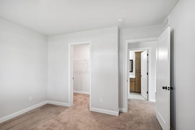 14221 Aspen Ave, Rosemount, MN 55068 - unfurnished bedroom with carpet flooring, a spacious closet, and a closet