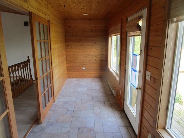 32468 County Highway 27, Elizabeth Twp, MN 56534 - unfurnished sunroom featuring french doors and a baseboard heating unit