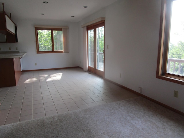 32468 County Highway 27, Elizabeth Twp, MN 56534 - unfurnished living room with light tile patterned floors and baseboards