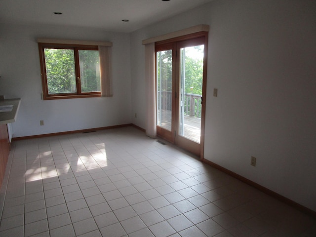 32468 County Highway 27, Elizabeth Twp, MN 56534 - spare room featuring plenty of natural light and light tile patterned floors