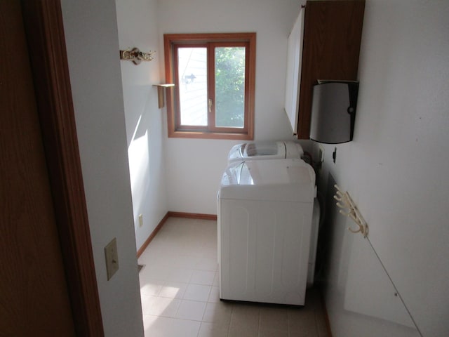 32468 County Highway 27, Elizabeth Twp, MN 56534 - laundry room with washer and clothes dryer and baseboards