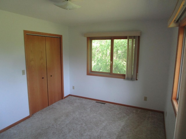 32468 County Highway 27, Elizabeth Twp, MN 56534 - unfurnished bedroom with a closet and carpet floors