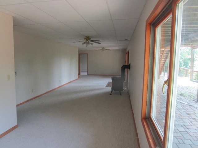 32468 County Highway 27, Elizabeth Twp, MN 56534 - spare room with a wood stove, ceiling fan, a drop ceiling, and light carpet