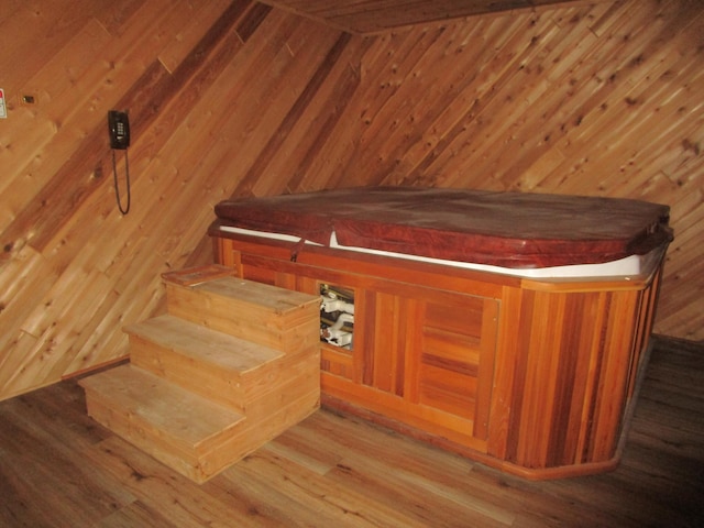 32468 County Highway 27, Elizabeth Twp, MN 56534 - staircase featuring a sauna, wood walls, and wood finished floors