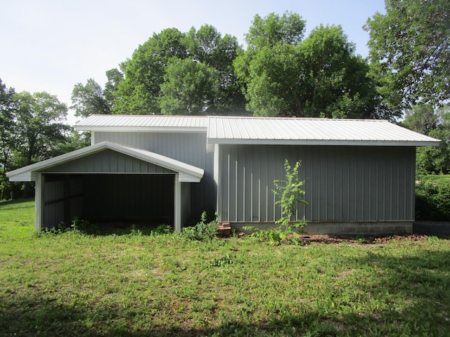 32468 County Highway 27, Elizabeth Twp, MN 56534 - view of side of home featuring a metal roof, a yard, and a pole building
