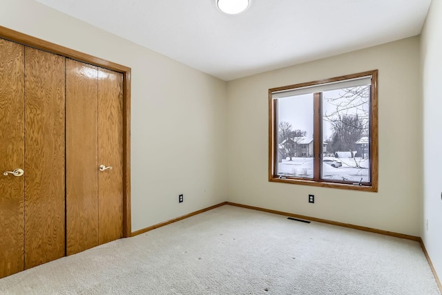 8210 208th St W, Lakeville, MN 55044 - unfurnished bedroom featuring light colored carpet and a closet