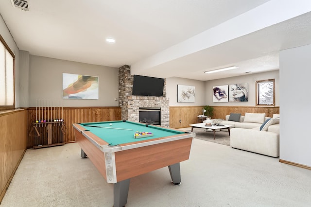 8210 208th St W, Lakeville, MN 55044 - playroom featuring a wainscoted wall, wood walls, light carpet, pool table, and a brick fireplace