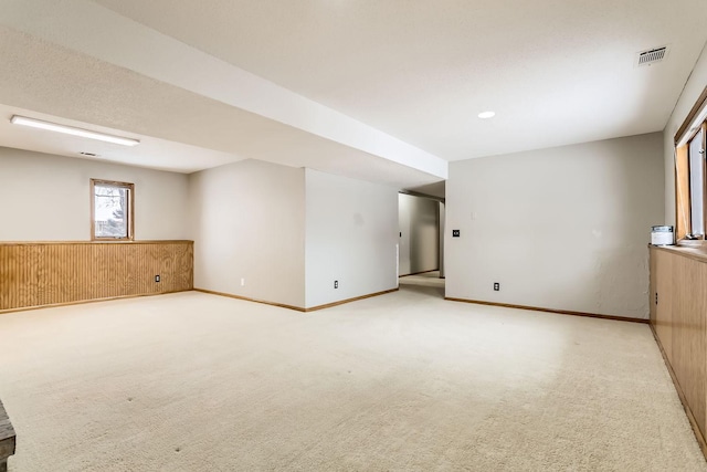 8210 208th St W, Lakeville, MN 55044 - unfurnished room with light carpet and wood walls