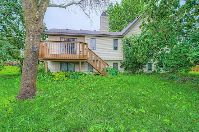 8210 208th St W, Lakeville, MN 55044 - rear view of house with a wooden deck, stairs, a chimney, and a yard