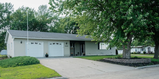 600 Venn St, Sherburn, MN 56171 - single story home with a garage, concrete driveway, and a front lawn