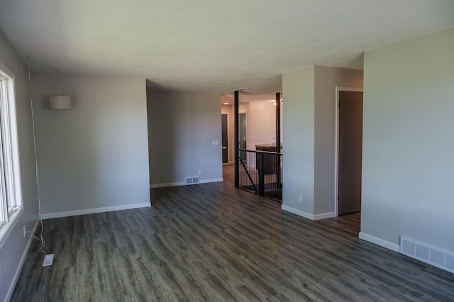 600 Venn St, Sherburn, MN 56171 - unfurnished room with dark wood-style floors and plenty of natural light