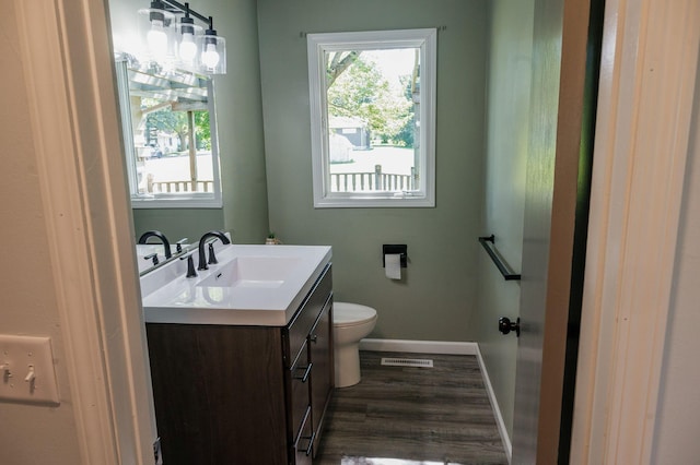 600 Venn St, Sherburn, MN 56171 - half bath featuring vanity and wood finished floors