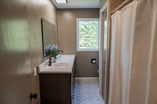 600 Venn St, Sherburn, MN 56171 - full bathroom with double vanity and baseboards