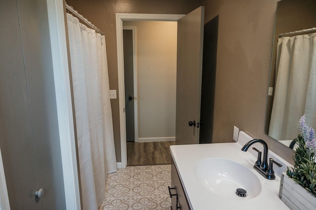 600 Venn St, Sherburn, MN 56171 - bathroom featuring vanity and baseboards