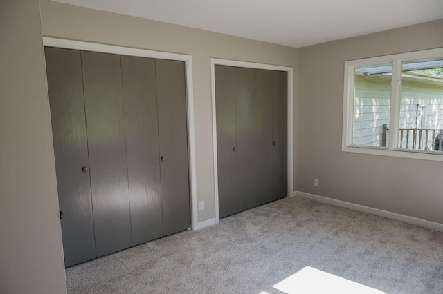 600 Venn St, Sherburn, MN 56171 - unfurnished bedroom featuring carpet floors and multiple closets