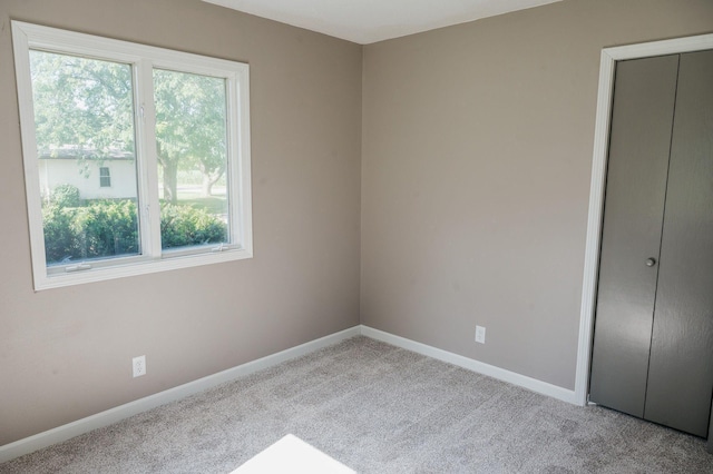 600 Venn St, Sherburn, MN 56171 - unfurnished bedroom with multiple windows, carpet flooring, and a closet