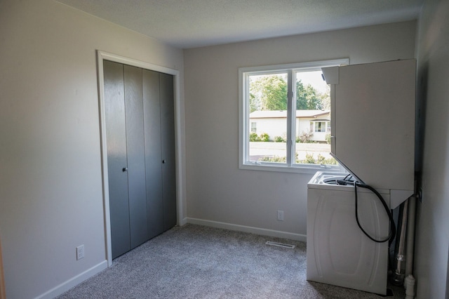 600 Venn St, Sherburn, MN 56171 - laundry area with carpet flooring and baseboards