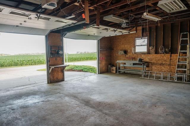 600 Venn St, Sherburn, MN 56171 - garage with a garage door opener and a rural view