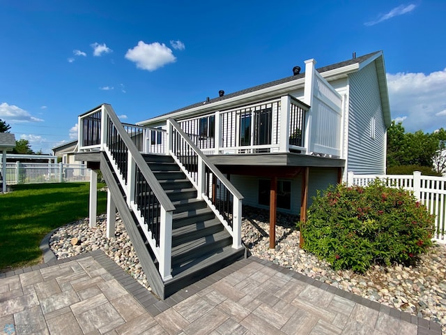 1506 Woodridge Ln, West Fargo, ND 58078 - rear view of house featuring stairs and a wooden deck