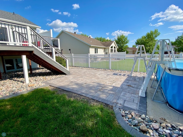 1506 Woodridge Ln, West Fargo, ND 58078 - view of patio with stairs and a wooden deck