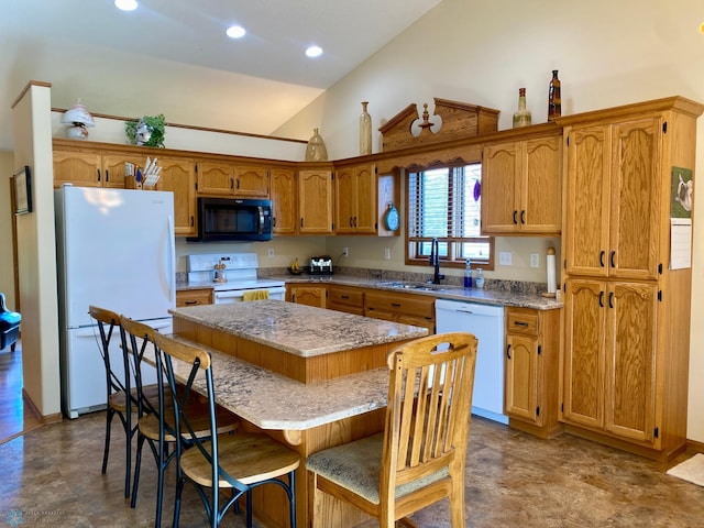 1506 Woodridge Ln, West Fargo, ND 58078 - kitchen featuring white appliances, vaulted ceiling, a center island, brown cabinetry, and recessed lighting