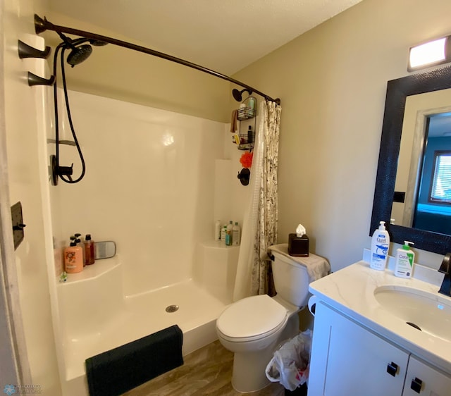 1506 Woodridge Ln, West Fargo, ND 58078 - full bathroom featuring vanity, a shower with shower curtain, and wood finished floors
