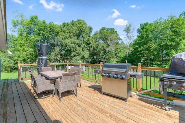 605 Central Ave SW, Cambridge, MN 55008 - deck featuring area for grilling, outdoor dining area, and view of scattered trees