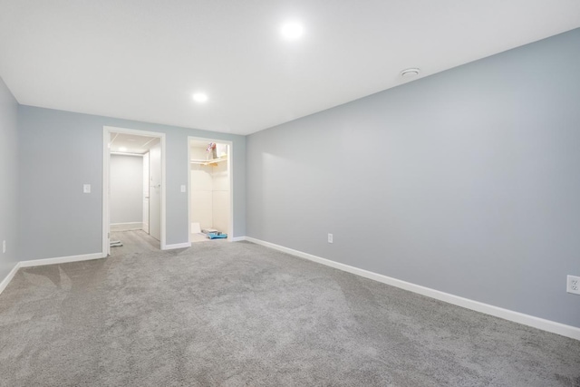 605 Central Ave SW, Cambridge, MN 55008 - unfurnished bedroom with a spacious closet, carpet floors, recessed lighting, and a closet
