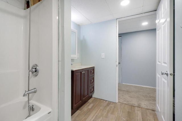 605 Central Ave SW, Cambridge, MN 55008 - full bathroom featuring vanity, wood finished floors, tub / shower combination, and recessed lighting