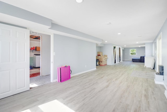 605 Central Ave SW, Cambridge, MN 55008 - unfurnished living room with light wood-style flooring and recessed lighting