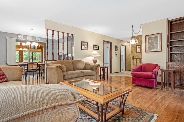6670 Maple Dr, Rockford, MN 55373 - living area featuring a chandelier and wood-type flooring