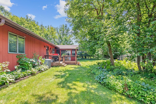 6670 Maple Dr, Rockford, MN 55373 - view of green lawn featuring a wooden deck