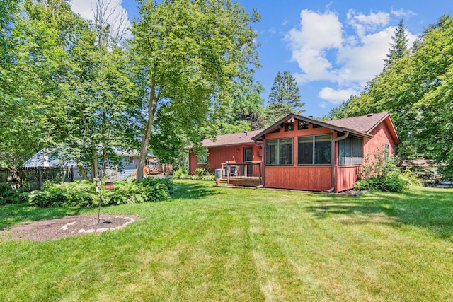 6670 Maple Dr, Rockford, MN 55373 - rear view of house featuring a sunroom and a deck