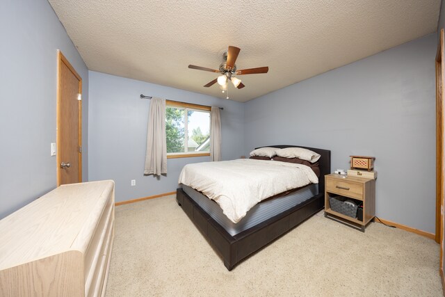 10815 Matthew Dr, Chisago City, MN 55013 - bedroom featuring carpet, ceiling fan, and a textured ceiling