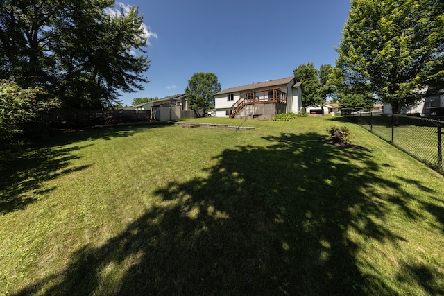 10815 Matthew Dr, Chisago City, MN 55013 - fenced backyard with a storage shed, stairs, and a wooden deck