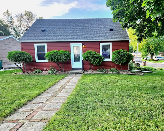 1302 Clark St, Albert Lea, MN 56007 - view of front of property featuring roof with shingles and a front lawn