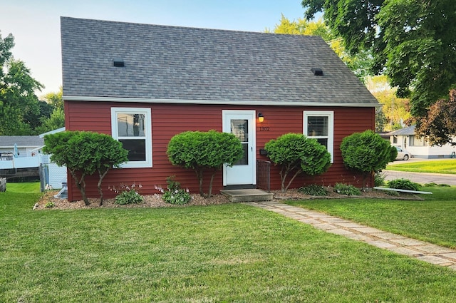 1302 Clark St, Albert Lea, MN 56007 - cape cod house with a shingled roof and a front yard