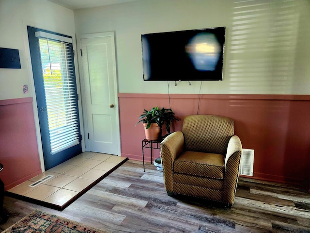 1302 Clark St, Albert Lea, MN 56007 - living area featuring wood finished floors and wainscoting
