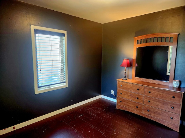 1302 Clark St, Albert Lea, MN 56007 - bedroom with dark wood-style floors and baseboards