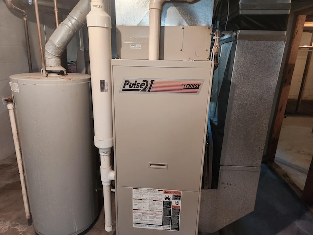 1302 Clark St, Albert Lea, MN 56007 - utility room featuring water heater and heating unit