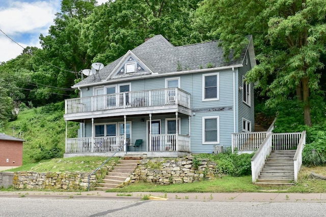 108 Hill St, Fountain City, WI 54629 - view of front of property with stairway, a porch, and a shingled roof