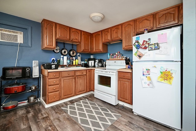 108 Hill St, Fountain City, WI 54629 - kitchen with white appliances, dark wood finished floors, brown cabinets, and light countertops