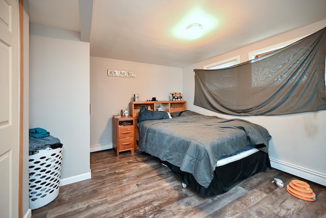 108 Hill St, Fountain City, WI 54629 - bedroom featuring baseboard heating and wood finished floors