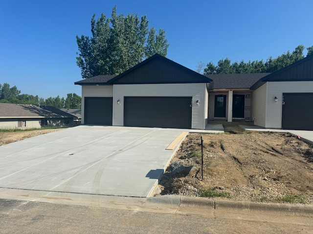 2031 20th St E, Zumbrota, MN 55992 - ranch-style home with an attached garage and concrete driveway