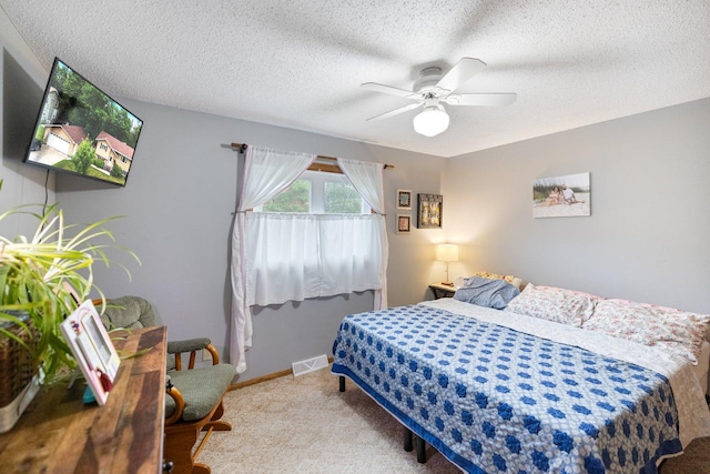 1902 3rd Ave, Grand Rapids, MN 55744 - carpeted bedroom featuring a textured ceiling and a ceiling fan