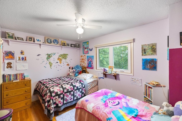 1902 3rd Ave, Grand Rapids, MN 55744 - bedroom with wood finished floors, a textured ceiling, and ceiling fan