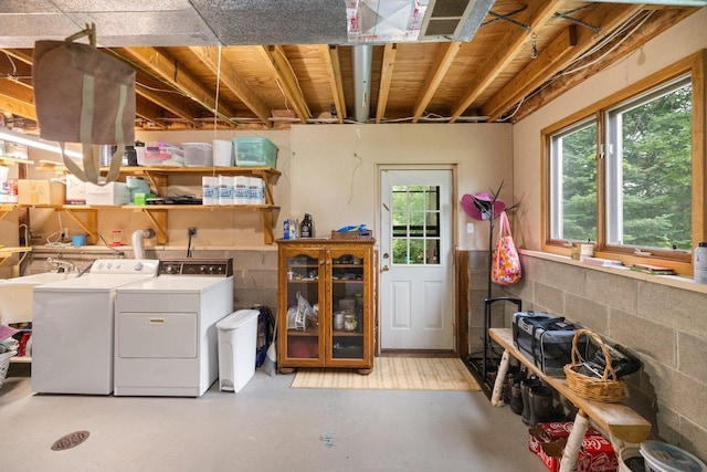1902 3rd Ave, Grand Rapids, MN 55744 - washroom featuring washing machine and dryer, healthy amount of natural light, and concrete block wall