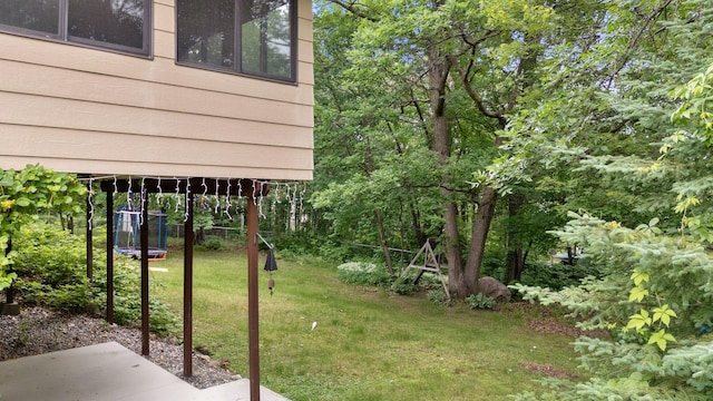 1902 3rd Ave, Grand Rapids, MN 55744 - view of grassy yard with a patio area